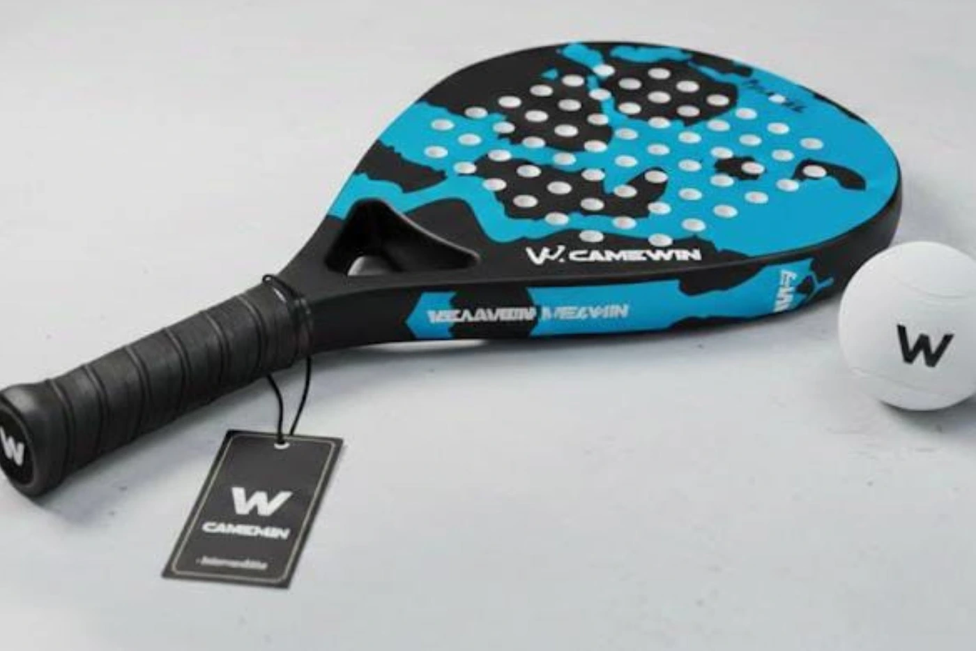 Black and blue Camewin padel racket with ball.